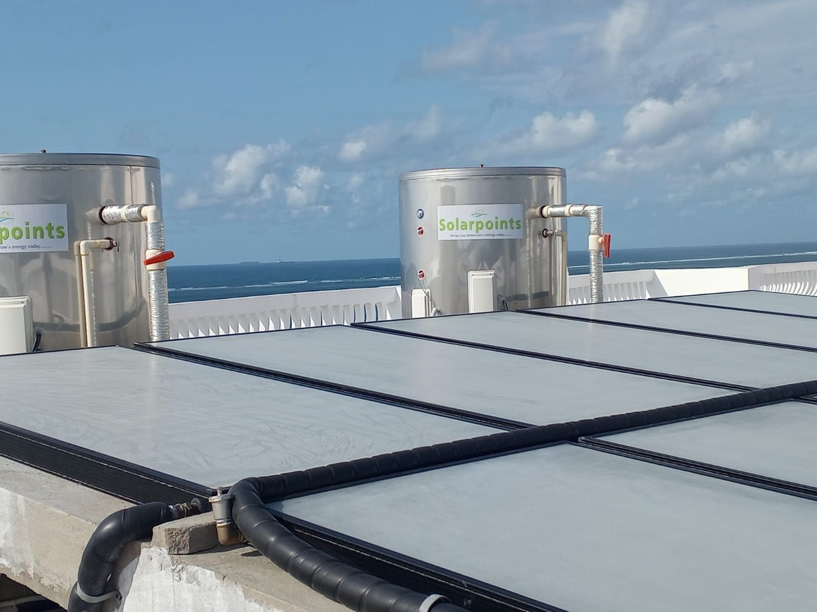 Centralised flat plate solar plant with two Solarpoints storage tanks on a Mombasa rooftop